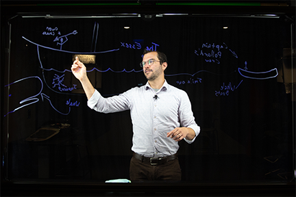 An instructor using the lightboard in the Digital Union: Recording Studio