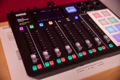 An image of the audio mixing board with faders and mute switches.